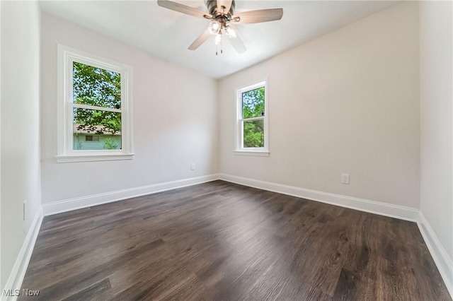 17207 Maple Heights Blvd, Maple Heights, OH 44137 - empty room with dark wood-style floors and a ceiling fan