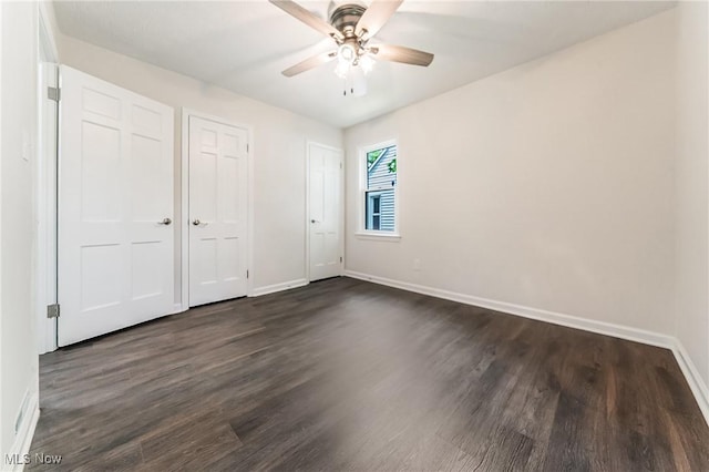 17207 Maple Heights Blvd, Maple Heights, OH 44137 - unfurnished bedroom with dark wood-type flooring and ceiling fan