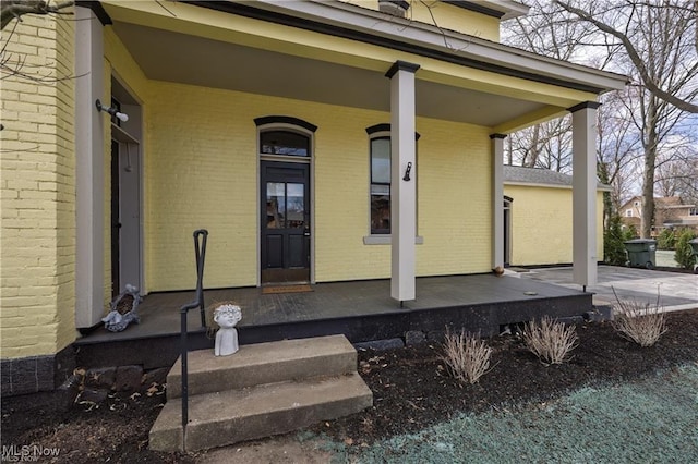 203 W 6th St, Dover, OH 44622 - doorway to property with a porch and brick siding
