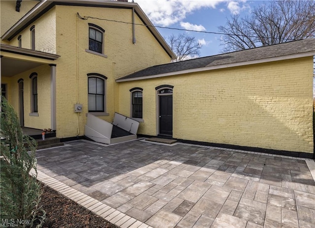 203 W 6th St, Dover, OH 44622 - back of house with a patio area and brick siding