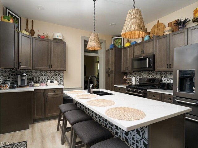203 W 6th St, Dover, OH 44622 - kitchen with stove, stainless steel fridge with ice dispenser, light countertops, and decorative backsplash
