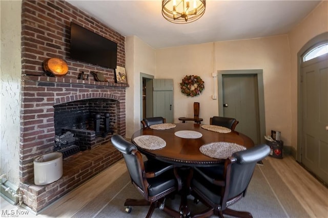203 W 6th St, Dover, OH 44622 - dining area with wood finished floors and a fireplace