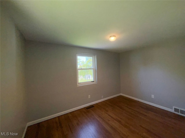 15920 Grove St, Middlefield, OH 44062 - empty room with wood finished floors and baseboards