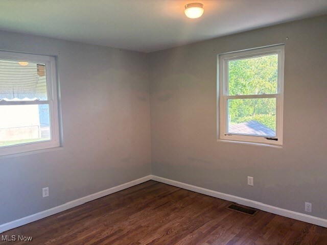 15920 Grove St, Middlefield, OH 44062 - empty room featuring baseboards and wood finished floors