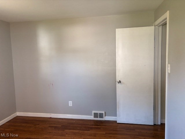 15920 Grove St, Middlefield, OH 44062 - spare room with wood finished floors and baseboards