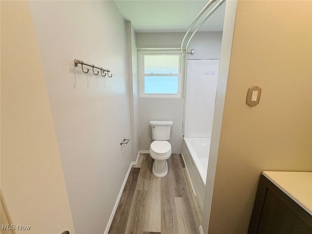 15920 Grove St, Middlefield, OH 44062 - full bath featuring wood finished floors, vanity, and shower / bath combination