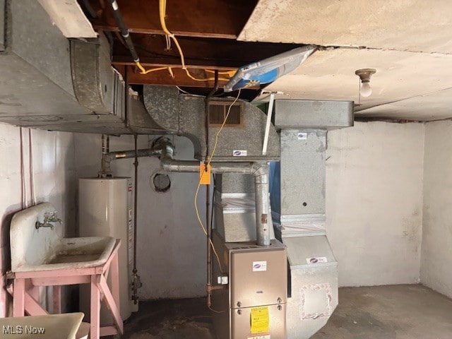 15920 Grove St, Middlefield, OH 44062 - utility room with water heater