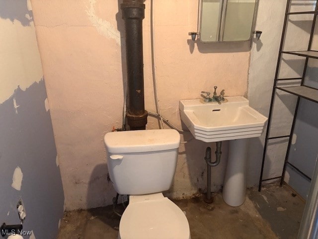 15920 Grove St, Middlefield, OH 44062 - bathroom featuring toilet and concrete flooring