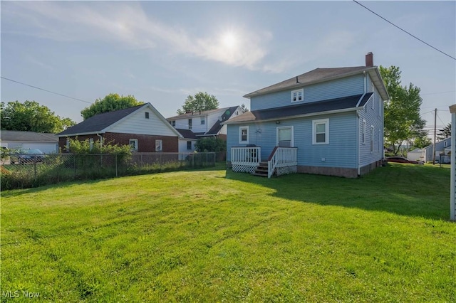 337 Garfield Ave NW, Carrollton, OH 44615 - rear view of property with a chimney