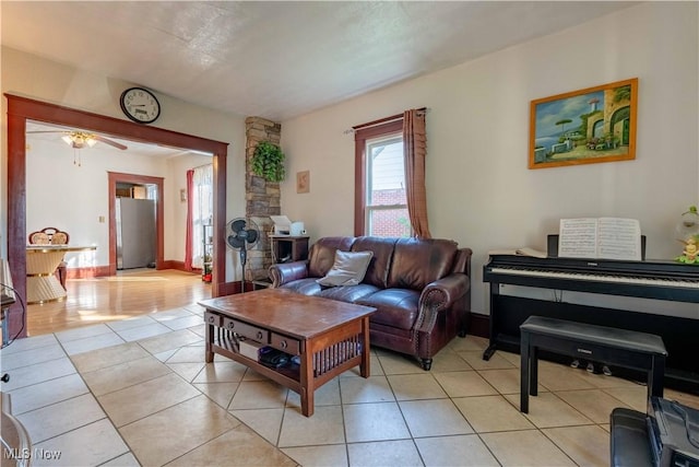 337 Garfield Ave NW, Carrollton, OH 44615 - living room featuring light tile patterned flooring and a ceiling fan