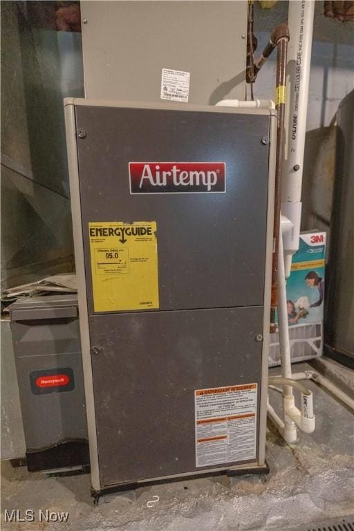 104 24th St NW, Massillon, OH 44647 - utility room with heating unit