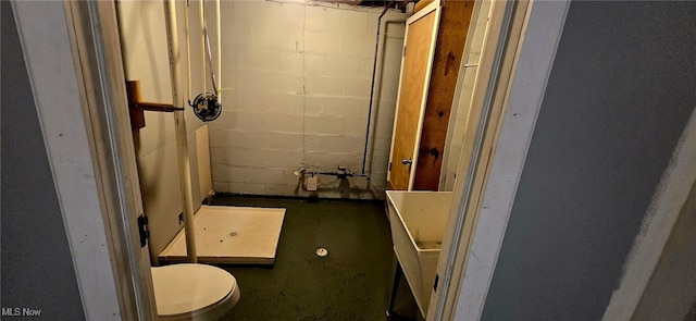 104 24th St NW, Massillon, OH 44647 - bathroom featuring a shower and unfinished concrete flooring