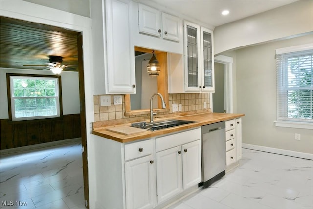 400 Spring St, Struthers, OH 44471 - kitchen with wooden counters, stainless steel dishwasher, light marble finish flooring, and recessed lighting
