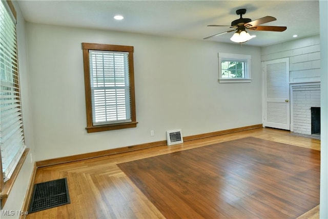 400 Spring St, Struthers, OH 44471 - unfurnished living room with ceiling fan, a brick fireplace, and recessed lighting