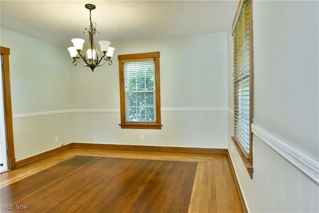 400 Spring St, Struthers, OH 44471 - spare room with a chandelier and wood finished floors