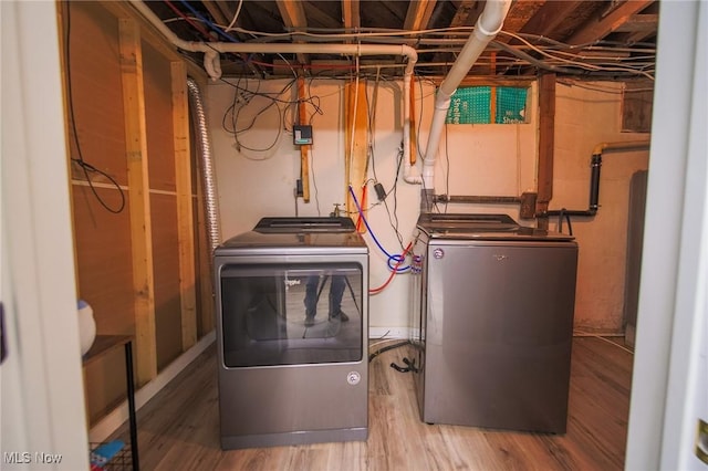 5251 Sugar Grove Rd, Cambridge, OH 43725 - laundry area featuring washer and clothes dryer and wood finished floors