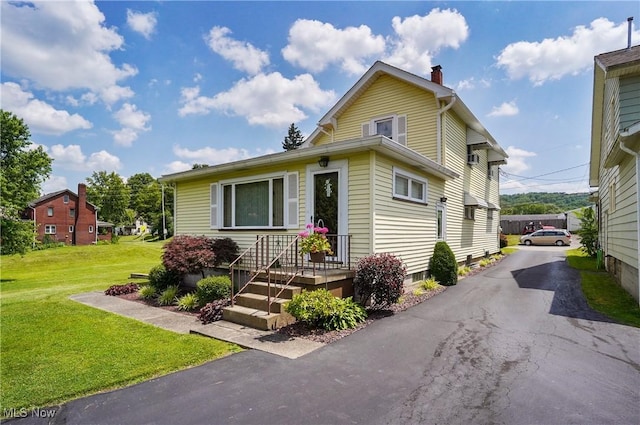 715 E Lincoln Way, Lisbon, OH 44432 - view of front of property featuring a chimney and a front yard
