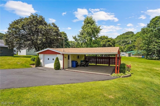 715 E Lincoln Way, Lisbon, OH 44432 - garage with asphalt driveway and a carport