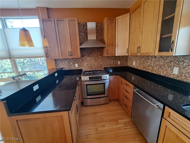 12595 Larchmere Blvd Unit E6, Cleveland, OH 44120 - kitchen with wall chimney exhaust hood, stainless steel appliances, light wood-style flooring, decorative backsplash, and dark stone countertops