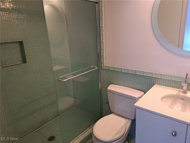 12595 Larchmere Blvd Unit E6, Cleveland, OH 44120 - bathroom featuring vanity, a stall shower, tile walls, and a wainscoted wall