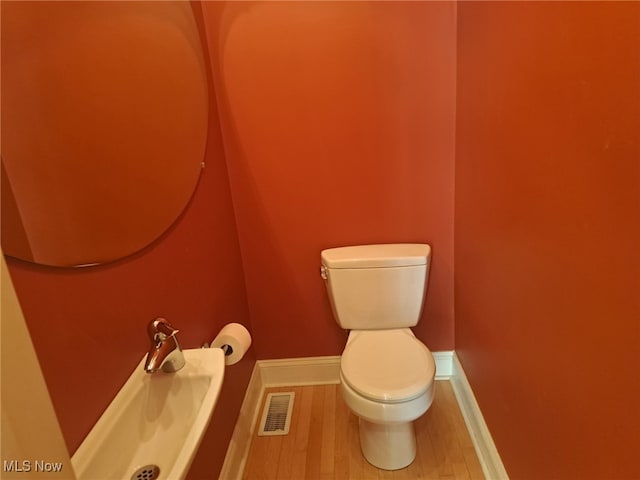 12595 Larchmere Blvd Unit E6, Cleveland, OH 44120 - bathroom featuring toilet and wood finished floors