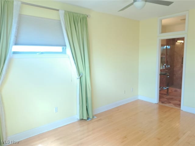 12595 Larchmere Blvd Unit E6, Cleveland, OH 44120 - empty room with light wood-style flooring and ceiling fan