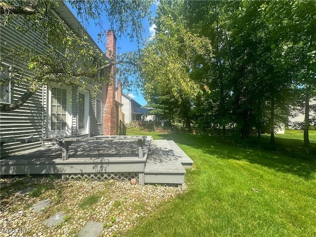 132 Beechwood Dr, Cortland, OH 44410 - view of grassy yard with a wooden deck