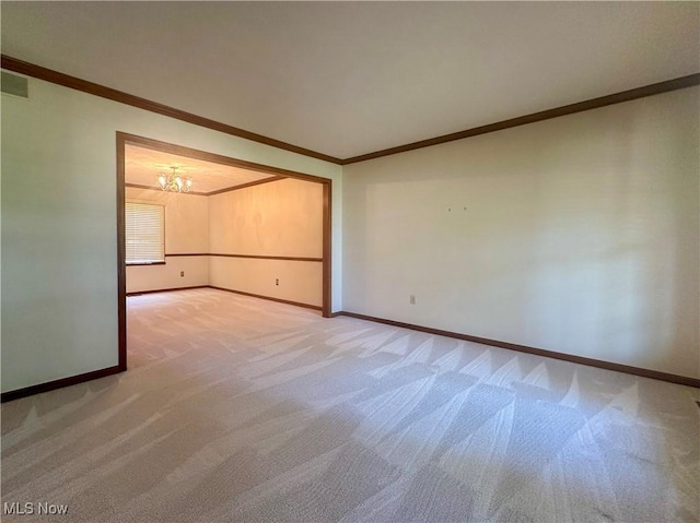 132 Beechwood Dr, Cortland, OH 44410 - empty room featuring light colored carpet, a chandelier, and ornamental molding