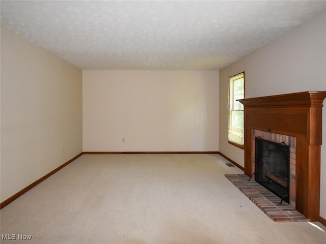 132 Beechwood Dr, Cortland, OH 44410 - unfurnished living room with a fireplace, light colored carpet, and a textured ceiling