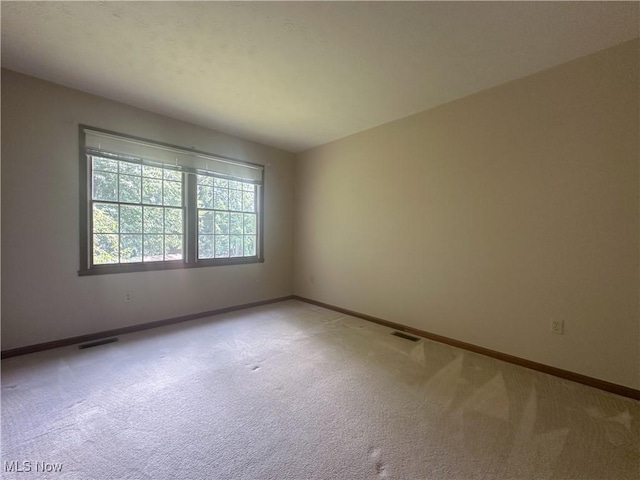 132 Beechwood Dr, Cortland, OH 44410 - spare room featuring light carpet and baseboards
