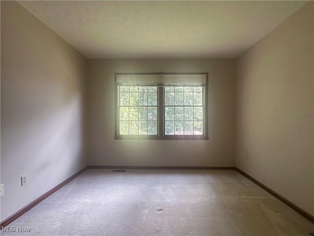 132 Beechwood Dr, Cortland, OH 44410 - carpeted spare room featuring baseboards