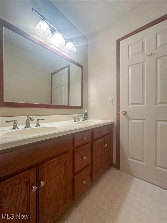132 Beechwood Dr, Cortland, OH 44410 - full bath with double vanity and tile patterned floors