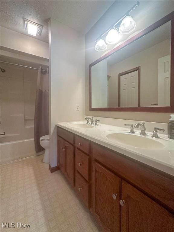 132 Beechwood Dr, Cortland, OH 44410 - full bathroom with double vanity, shower / tub combo with curtain, and tile patterned floors