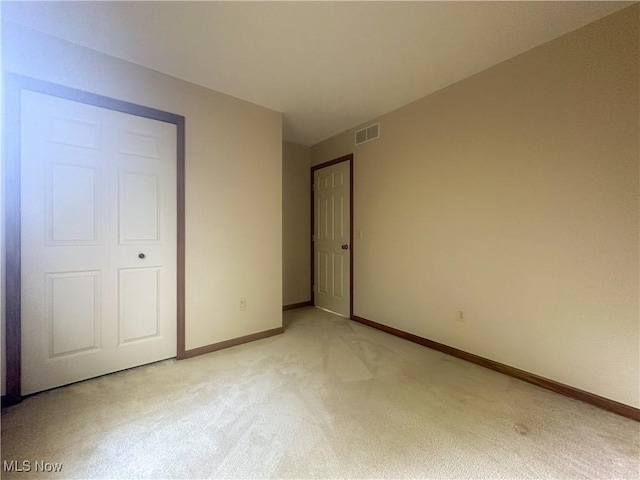 132 Beechwood Dr, Cortland, OH 44410 - unfurnished bedroom featuring light colored carpet and baseboards