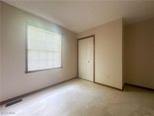 132 Beechwood Dr, Cortland, OH 44410 - empty room featuring plenty of natural light and light carpet