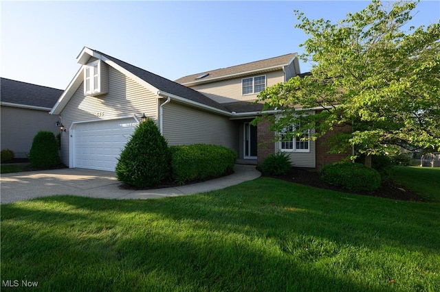 596 Glenmere Pl, Barberton, OH 44203 - traditional-style house featuring driveway, a front lawn, and a garage