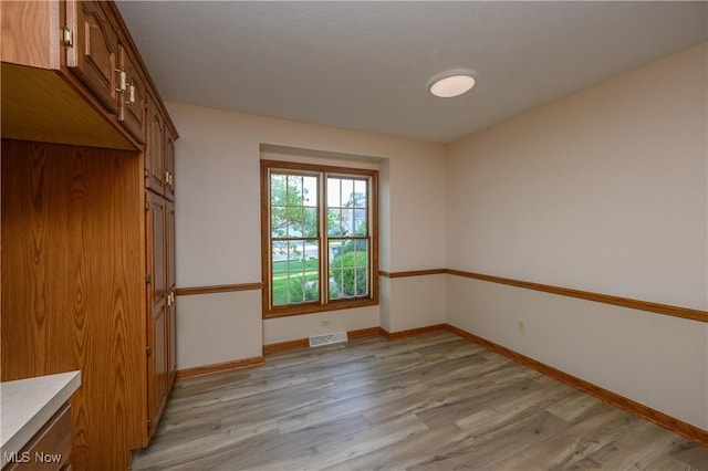 596 Glenmere Pl, Barberton, OH 44203 - unfurnished room with light wood-type flooring and baseboards
