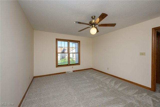 596 Glenmere Pl, Barberton, OH 44203 - unfurnished room with light colored carpet and ceiling fan