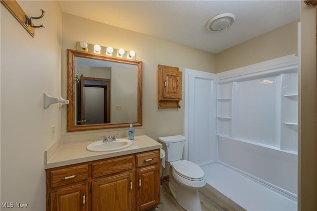 596 Glenmere Pl, Barberton, OH 44203 - bathroom with vanity, a shower, and wood finished floors