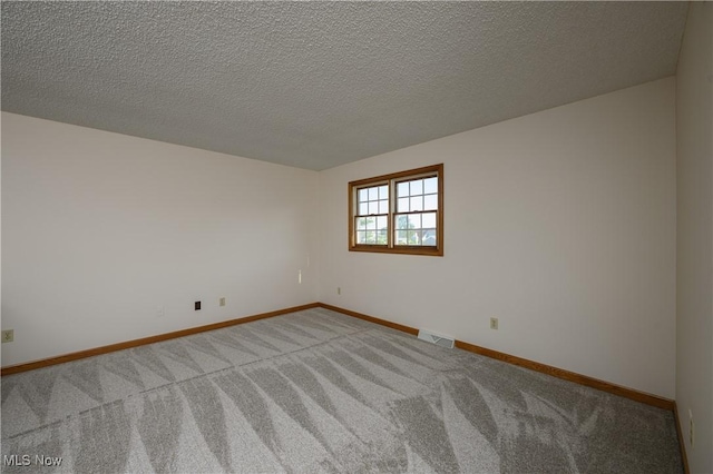 596 Glenmere Pl, Barberton, OH 44203 - spare room with light colored carpet and a textured ceiling