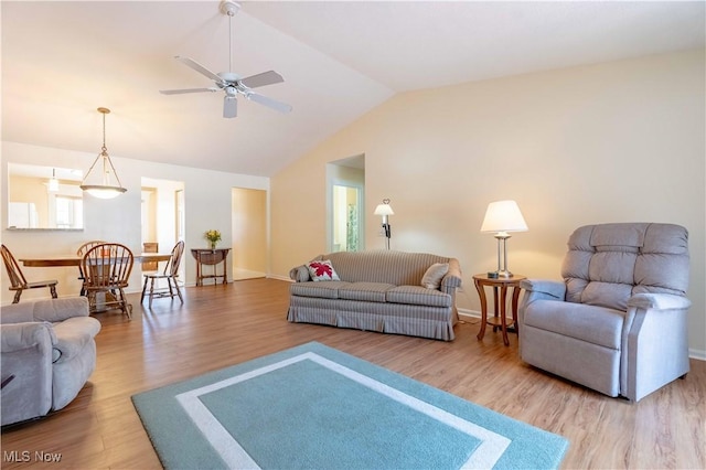 6706 Hogan Way NW, Canton, OH 44718 - living room featuring wood finished floors, vaulted ceiling, and a ceiling fan