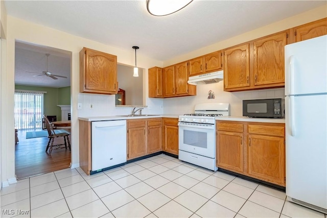 6706 Hogan Way NW, Canton, OH 44718 - kitchen with white appliances, under cabinet range hood, light countertops, a ceiling fan, and backsplash