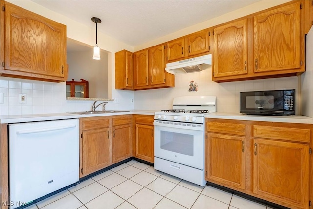 6706 Hogan Way NW, Canton, OH 44718 - kitchen featuring white appliances, under cabinet range hood, light countertops, and tasteful backsplash