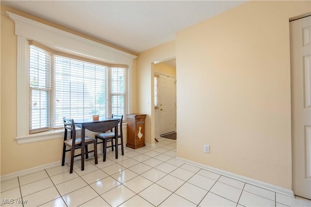6706 Hogan Way NW, Canton, OH 44718 - dining area with healthy amount of natural light and light tile patterned flooring