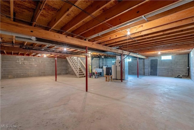 6706 Hogan Way NW, Canton, OH 44718 - unfinished basement featuring stairway and electric water heater