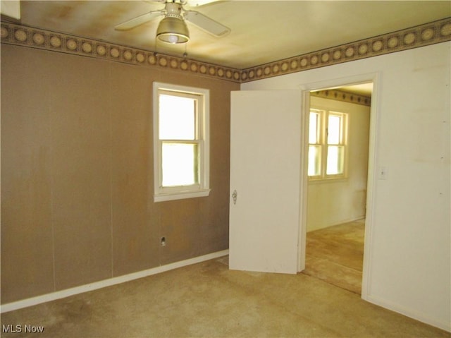 12316 Sunset Dr, Garfield Heights, OH 44125 - empty room featuring light carpet and ceiling fan