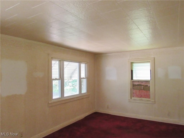 12316 Sunset Dr, Garfield Heights, OH 44125 - unfurnished room featuring baseboards and dark carpet