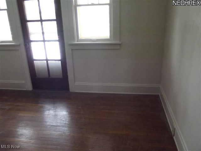 5257 Philip St, Maple Heights, OH 44137 - doorway featuring dark wood-type flooring and baseboards