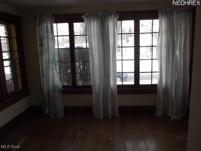 5257 Philip St, Maple Heights, OH 44137 - unfurnished room featuring dark wood-style floors and plenty of natural light