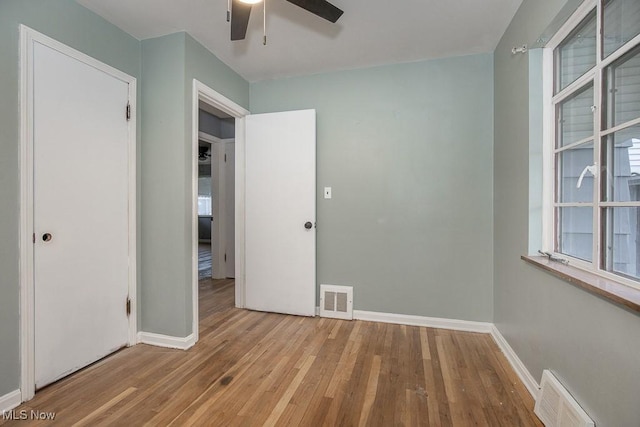 11202 Mountview Ave, Garfield Heights, OH 44125 - unfurnished bedroom with wood finished floors and ceiling fan